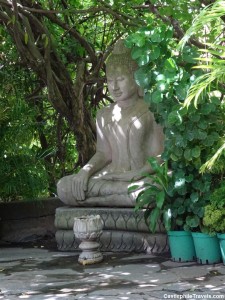 A statue of Buddha in the gardens of 'Kailassa Mountain'.